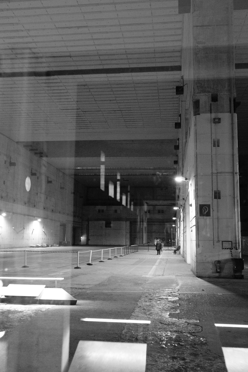 a black and white photo of an empty parking garage