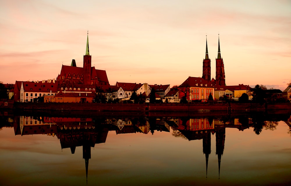 a large body of water with a city in the background