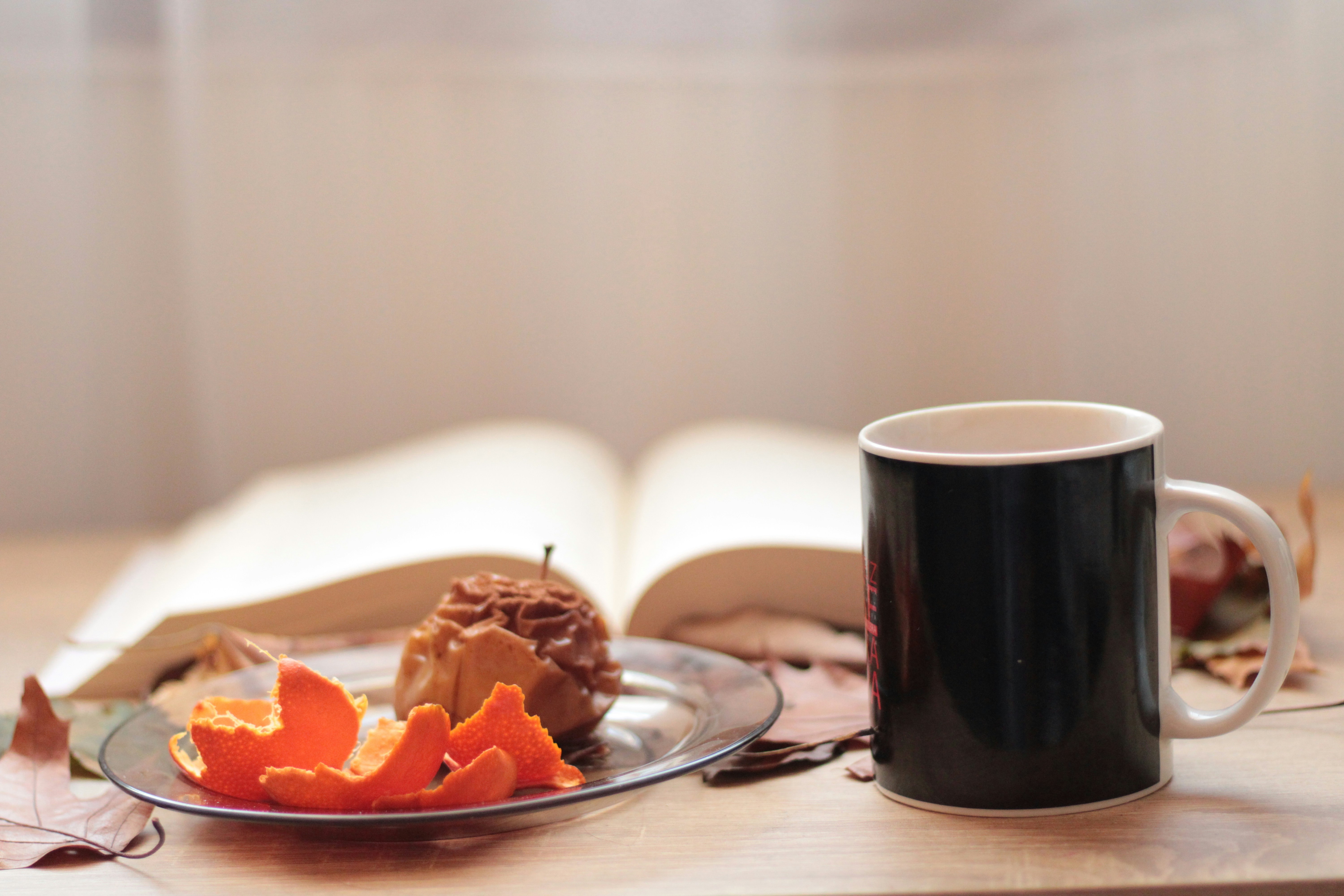 a plate of food and a cup of coffee on a table