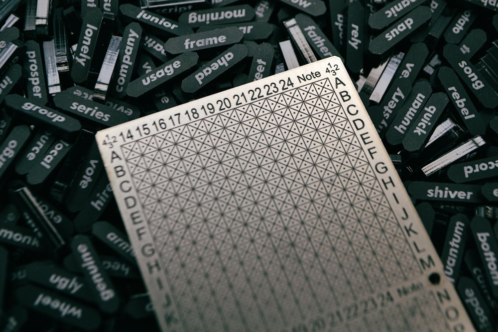 a pile of black and white tags with numbers on them