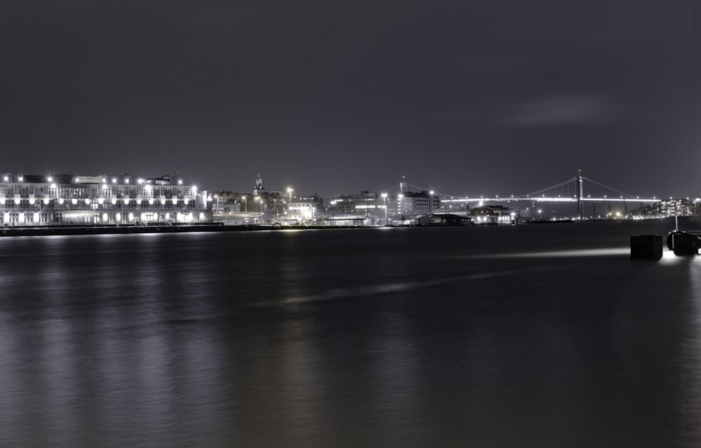 a black and white photo of a city at night