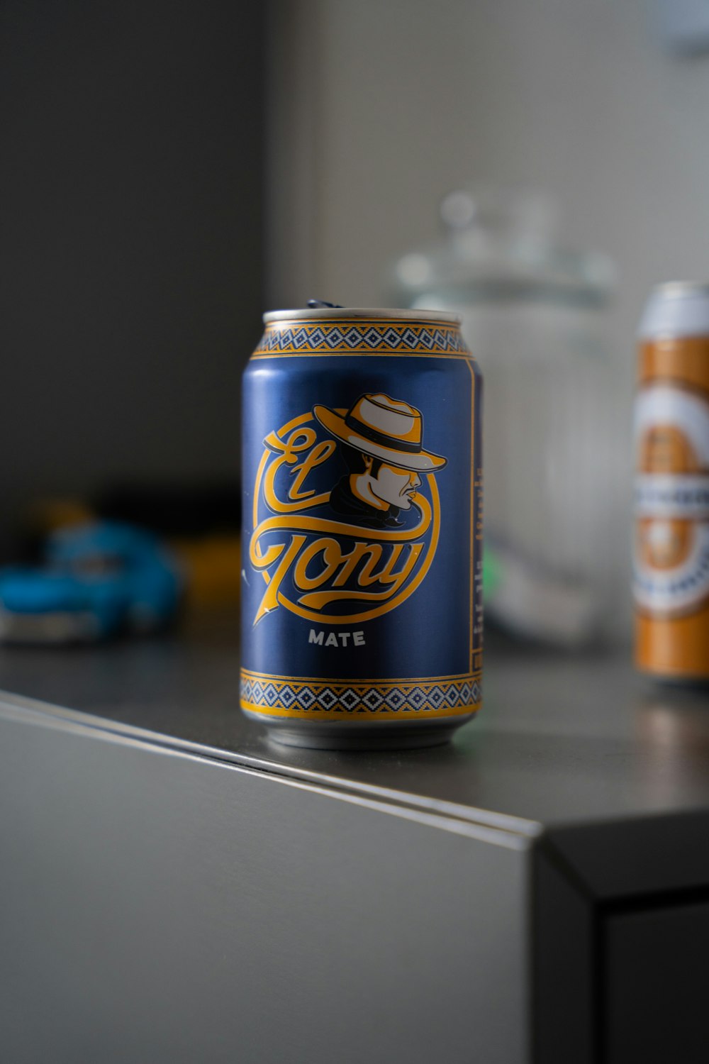 a can of beer sitting on top of a counter