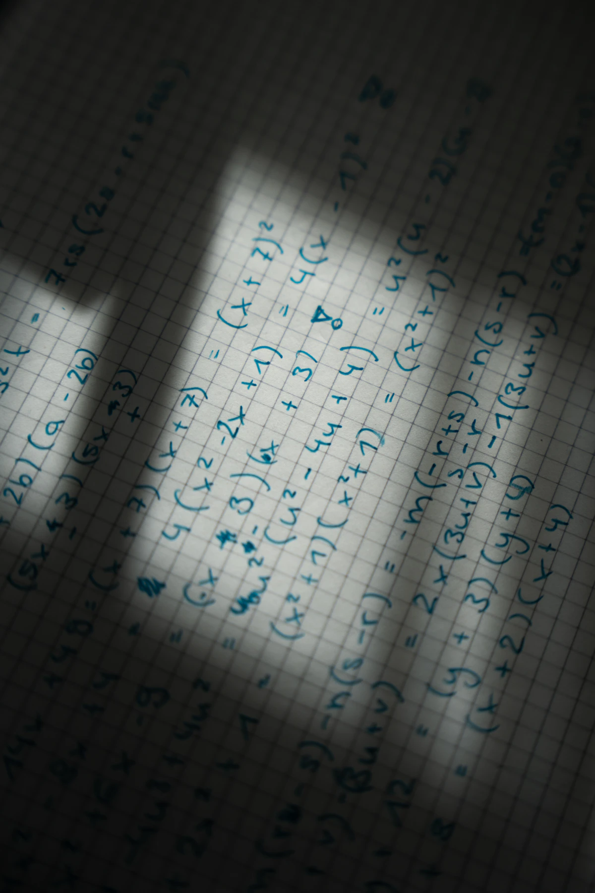 Handwritten mathematics working shown on graph paper, the kind of independently produced written work Paper 032 is designed to verify