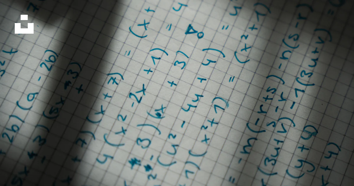 Looking At Math Paper A close up of a sheet of paper with writing on it photo – Free Math ...