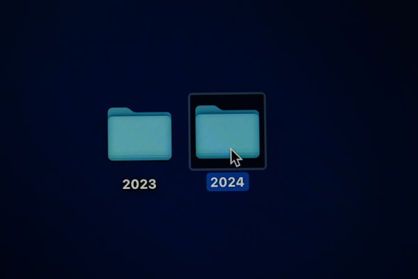 two folders, reading 2023 and 2024, respectively, on a computer desktop, with the cursor highlighting the 2024 folder