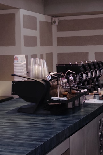 A sleek Sunday Coffee automated station in a bustling office lobby.