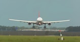 An aircraft landing smoothly on a runway.