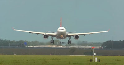 An aircraft landing smoothly on a runway.