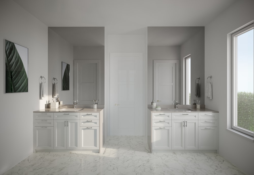 a large bathroom with two sinks and two mirrors