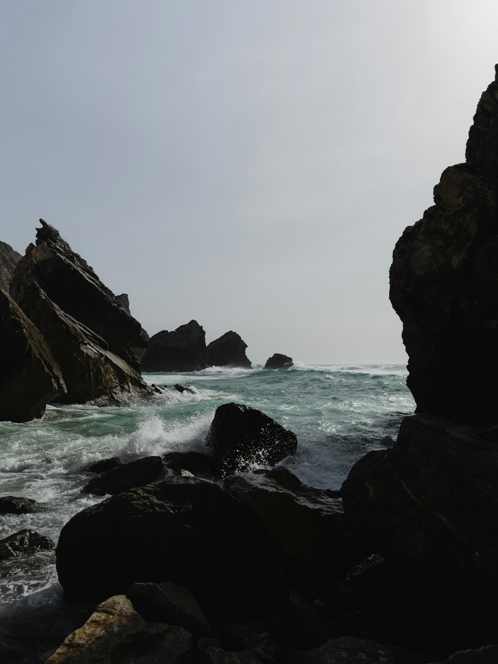 a large body of water surrounded by rocks