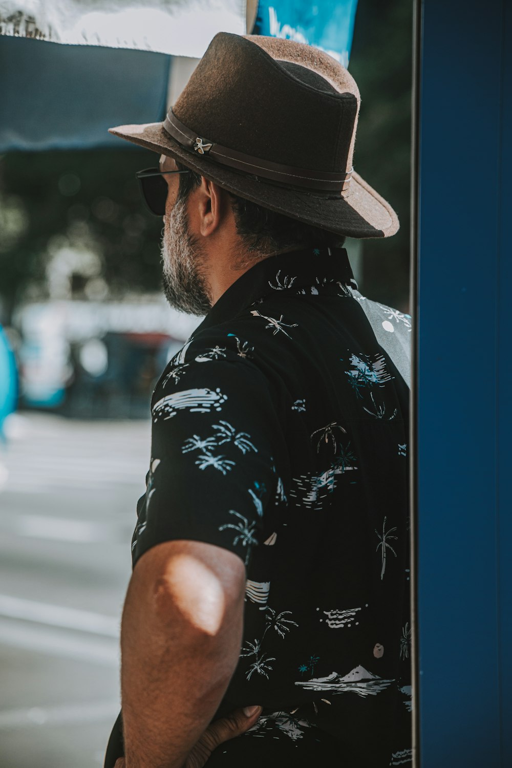 a man wearing a hat and a black shirt