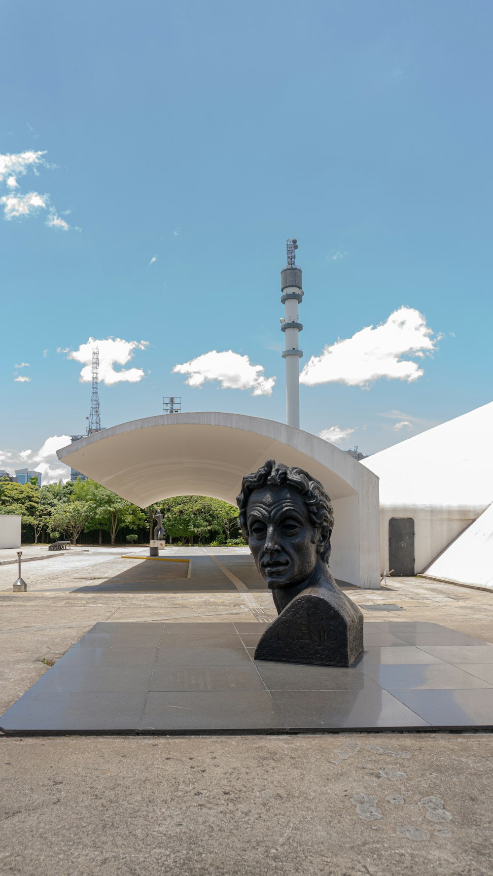 a statue of a man in front of a building