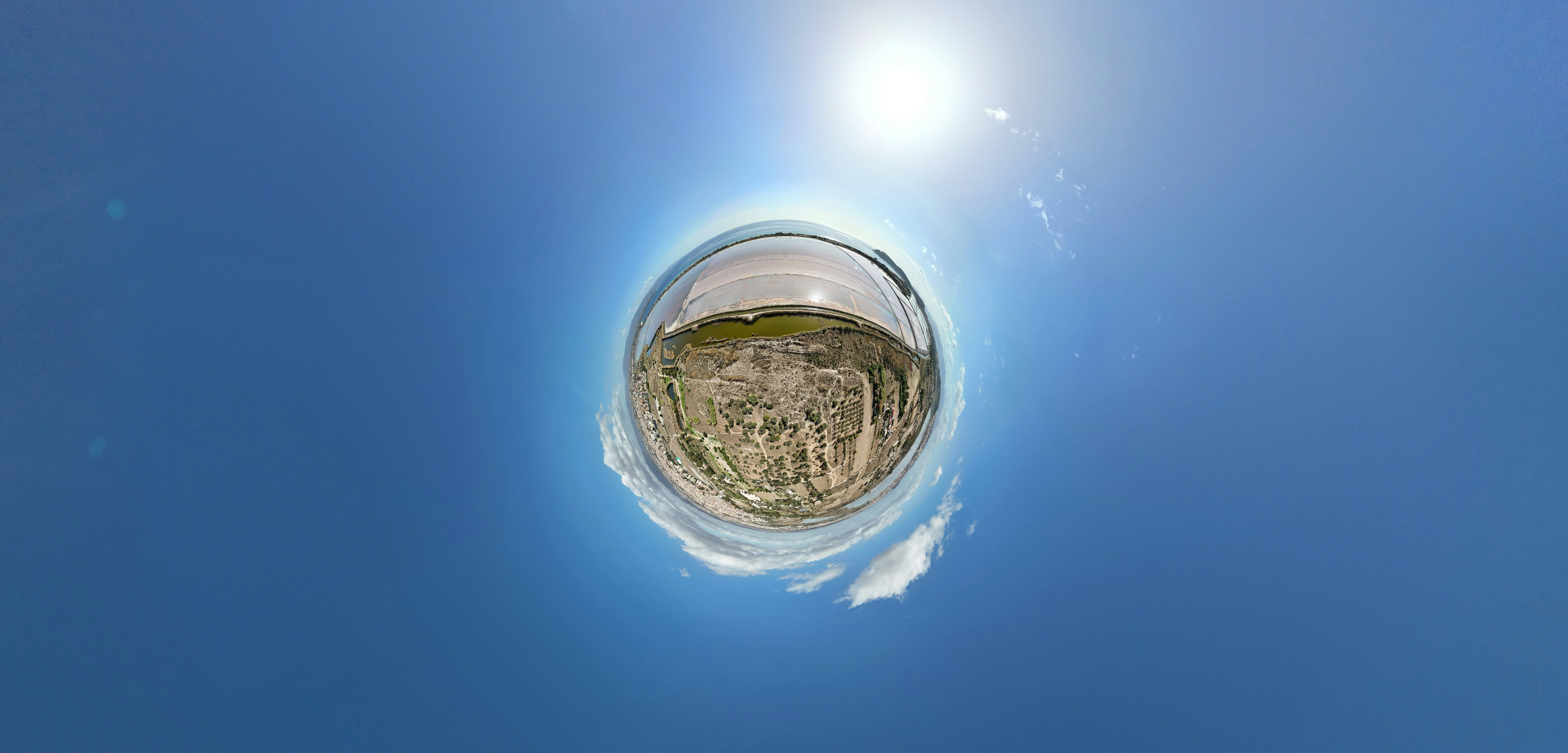 a fish eye view of the sky and clouds