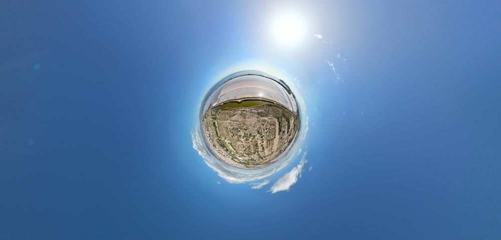 a fish eye view of the sky and clouds