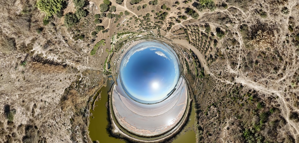 an aerial view of a lake surrounded by trees