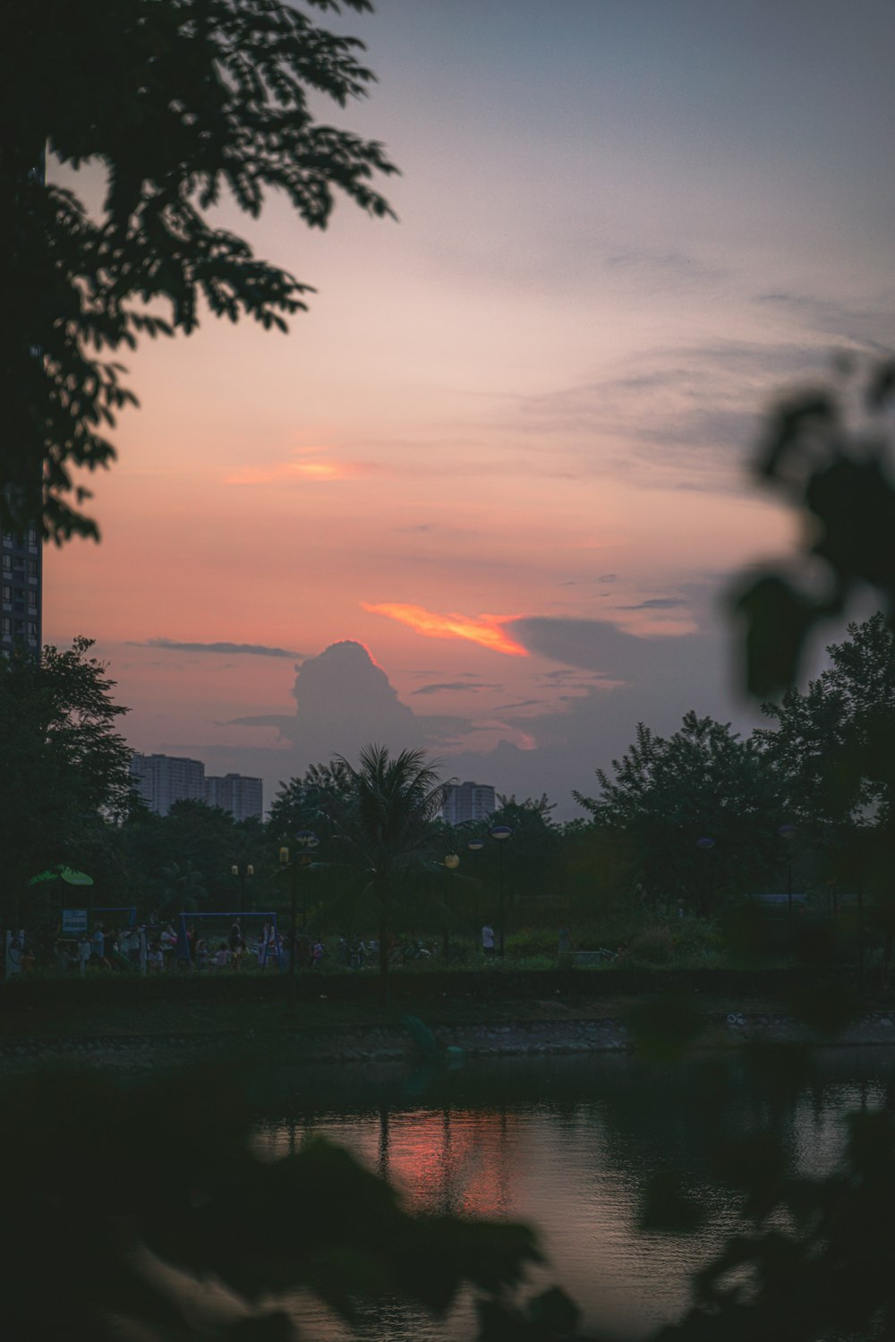 the sun is setting over a body of water