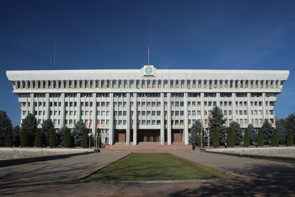 a large white building with a clock on top of it