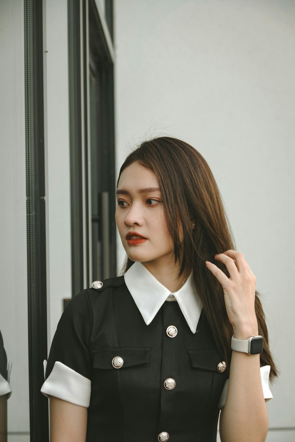 a woman with long hair wearing a uniform