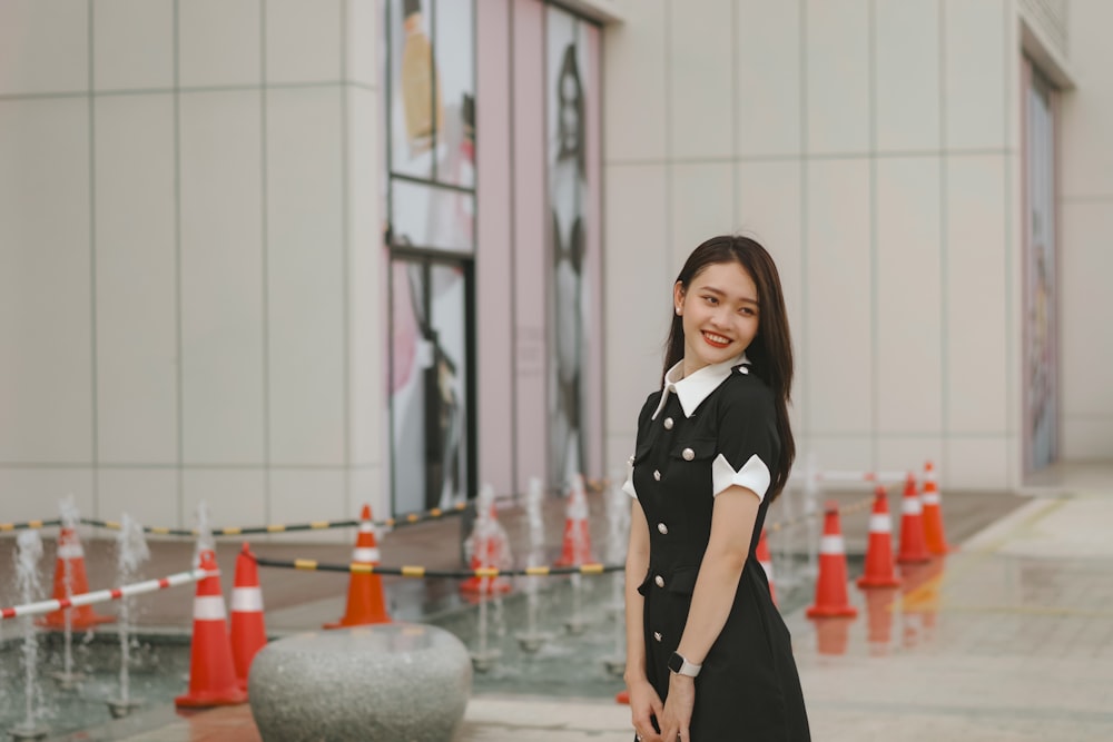 a woman standing in front of a building