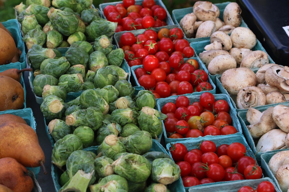 a variety of vegetables are on display at a market