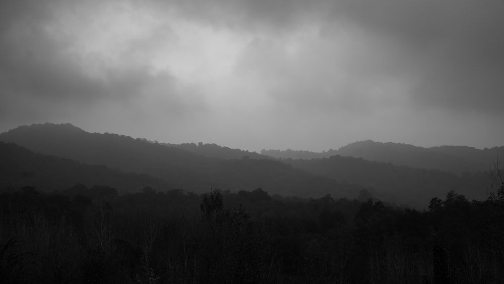 a black and white photo of a mountain range