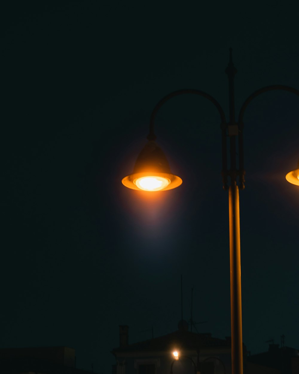 a couple of street lights sitting next to each other