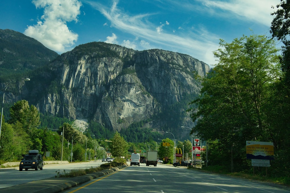 a road with a mountain in the background