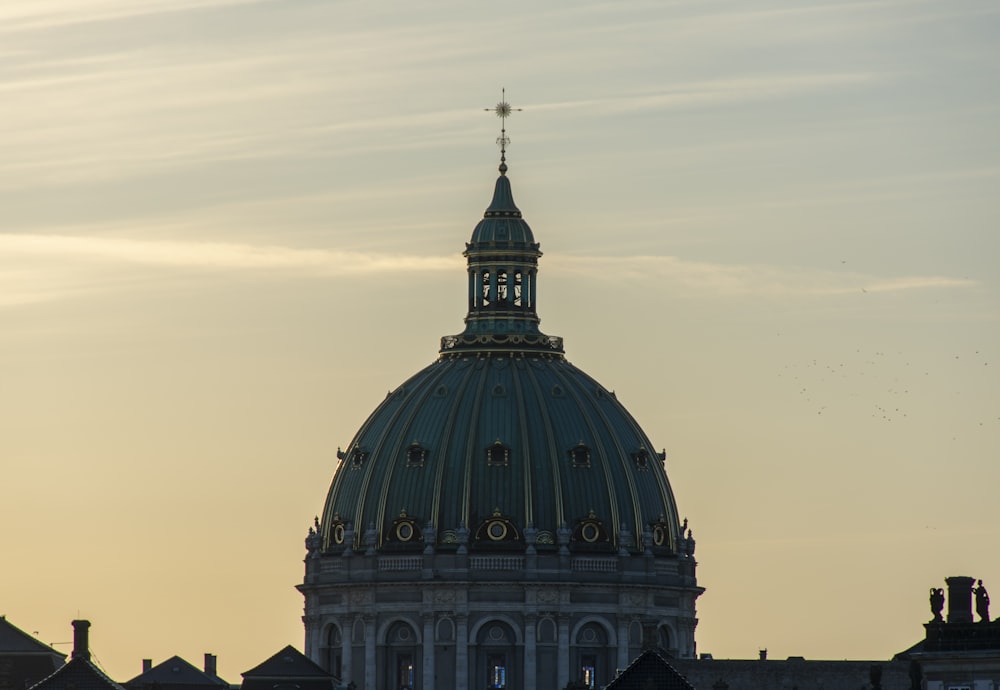 a large dome with a cross on top of it