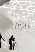 Elegant glass balustrade installed on a staircase with Islamic design elements.