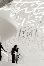 Elegant glass balustrade installed on a staircase with Islamic design elements.