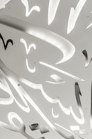 An abstract ceiling design featuring intricate, sculptural cutouts with soft, curved shapes. Gentle lighting emanates from within the cutouts, creating a contrast between illuminated areas and shadows. The overall appearance is modern and artistic, with a sleek and clean design.