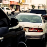 The Lexus ES showcased on a modern urban street with soft reflections highlighting its curves.
