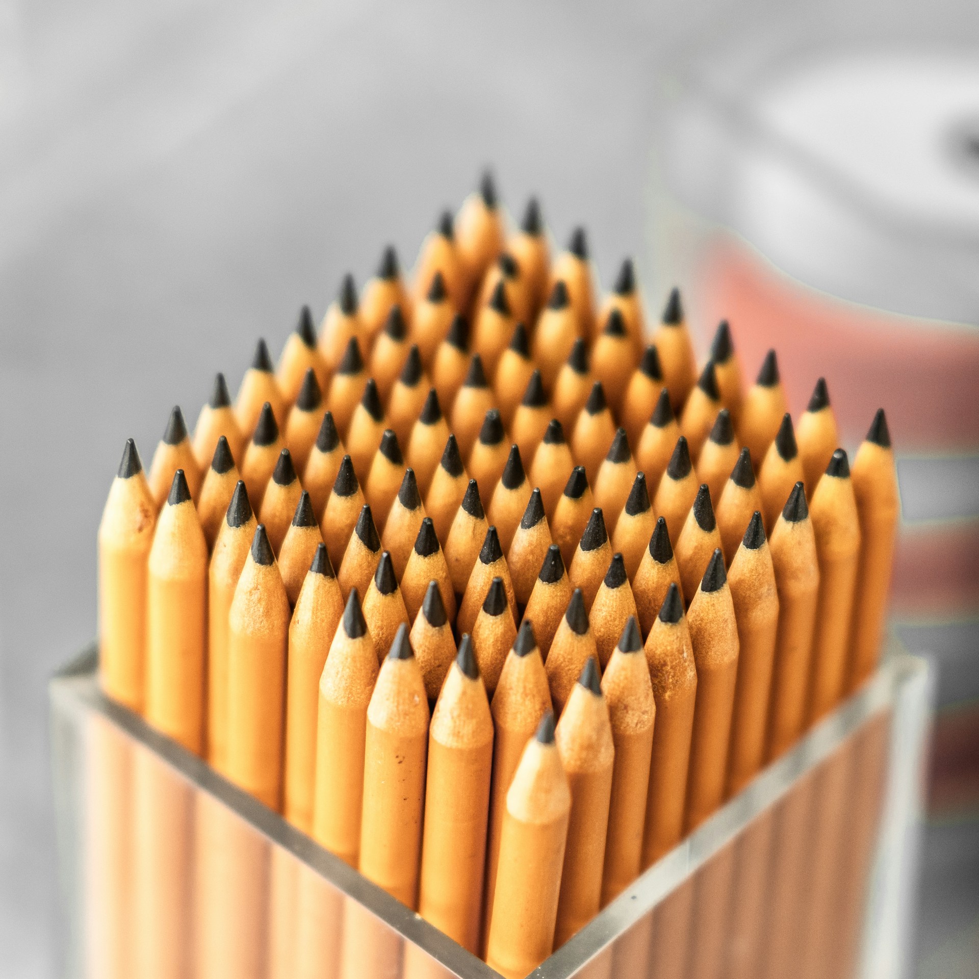 a bunch of pencils that are in a container