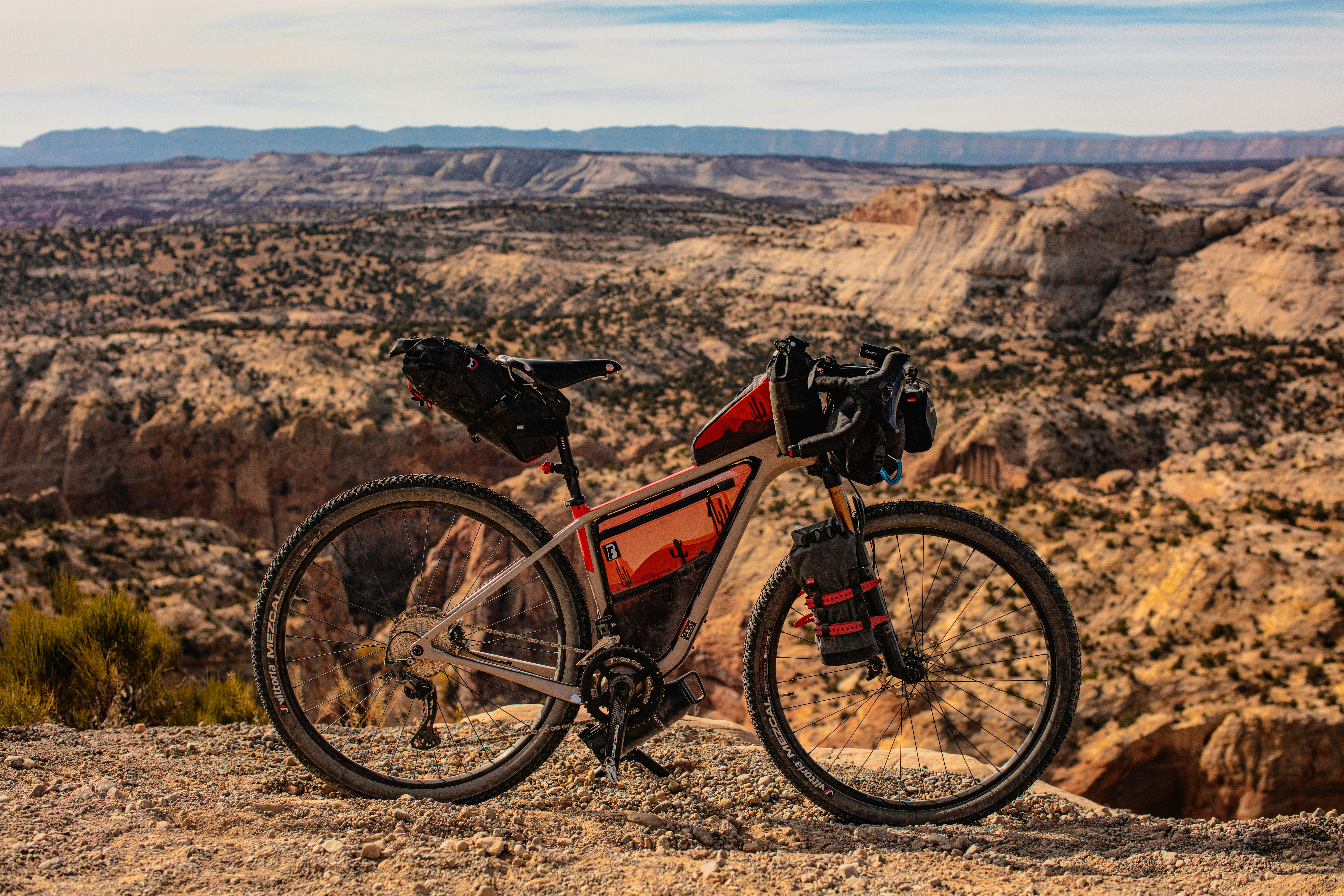 a bike parked on top of a rocky hill