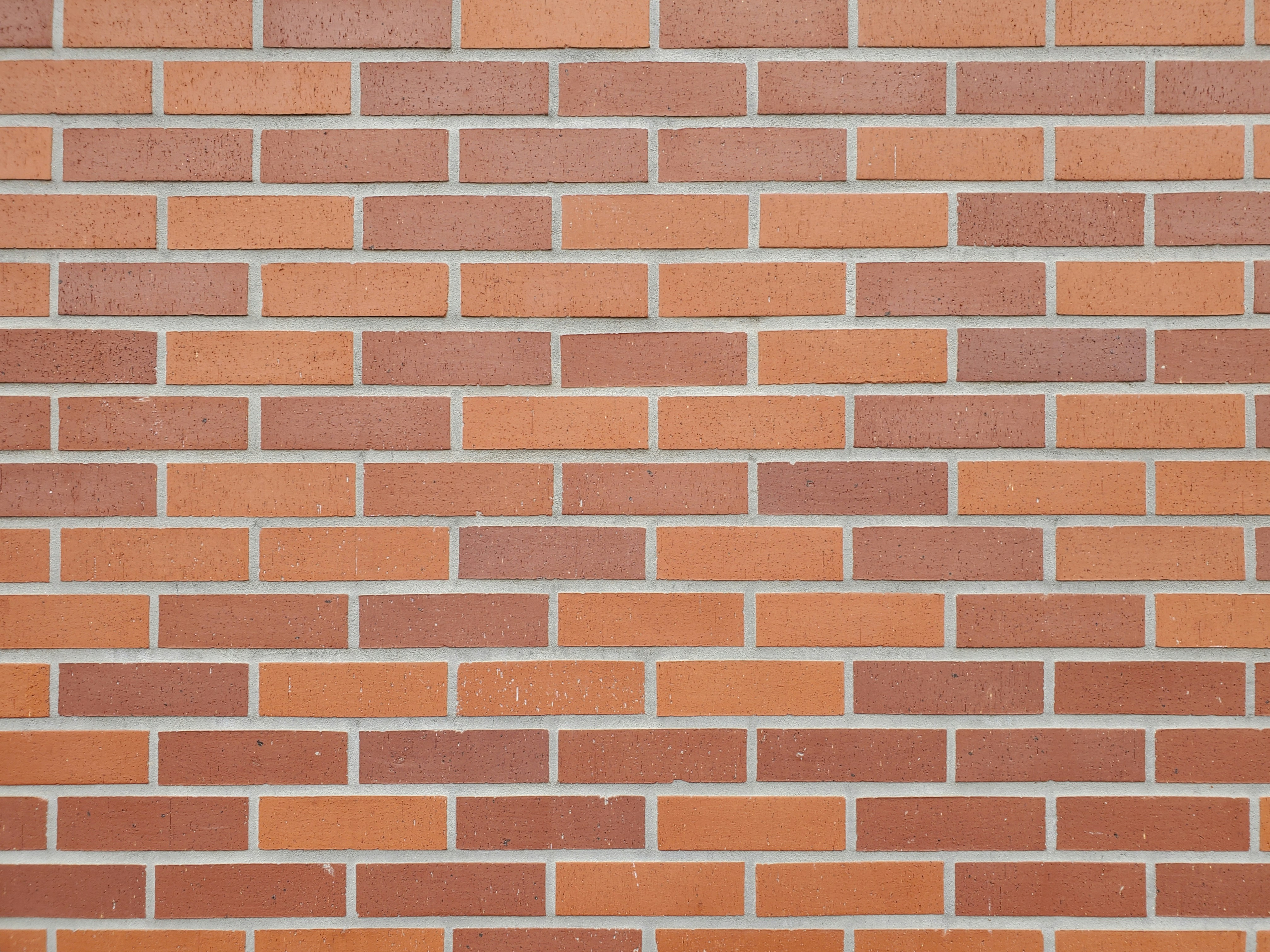 a close up of a red brick wall