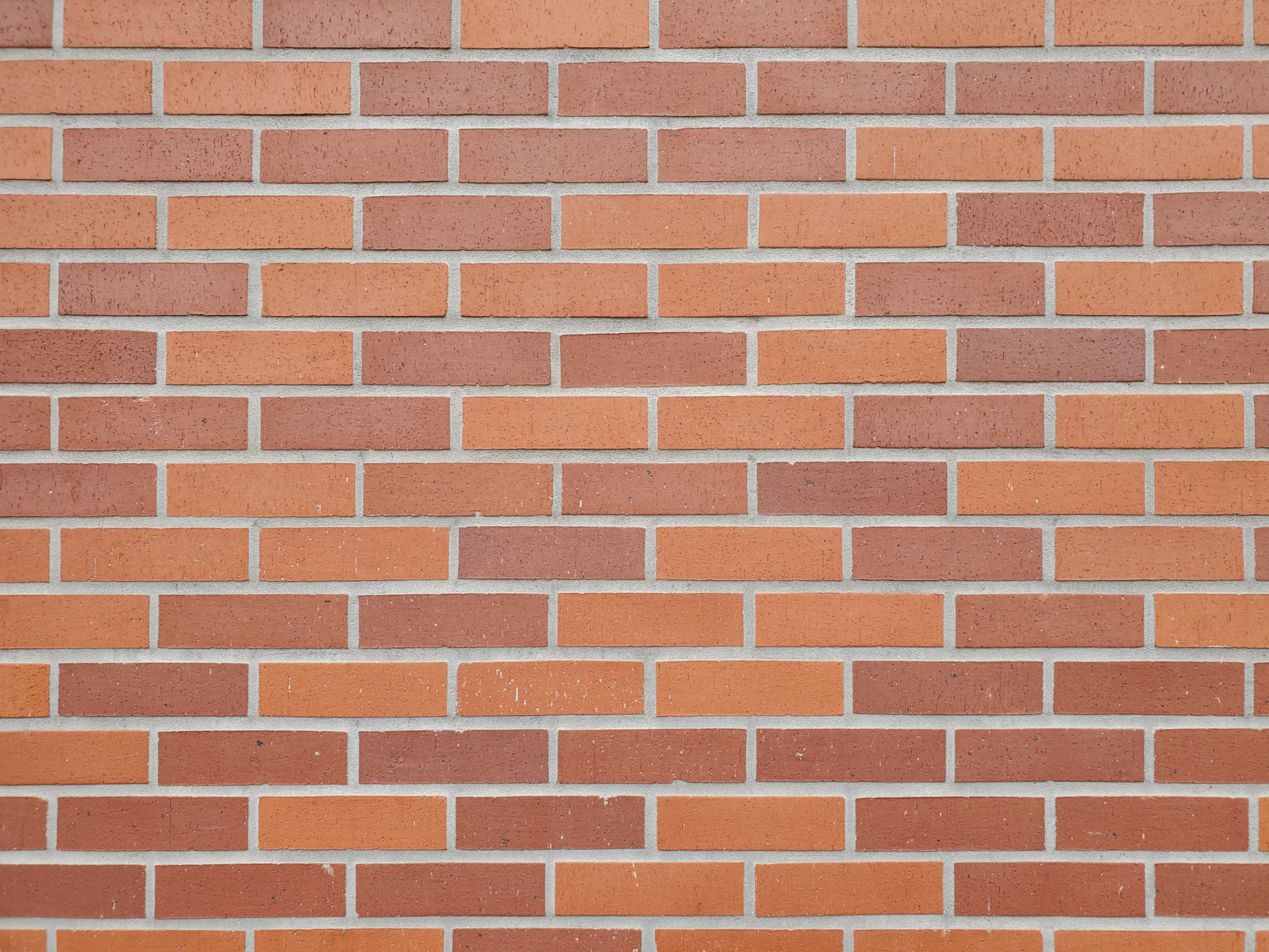 a close up of a red brick wall