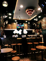 Cozy coffee shop interior with warm lighting and elegant decor at Monteclaro.