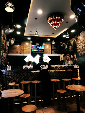 Cozy coffee shop interior with warm lighting and elegant decor at Monteclaro.