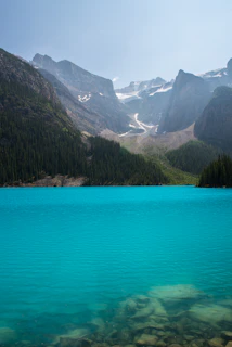 Crystal-clear waters of Laguna de Busa surrounded by vibrant nature