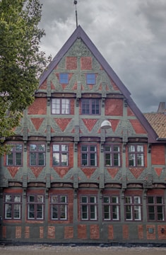 A historic colonial-style building with intricate details in Malang city center.