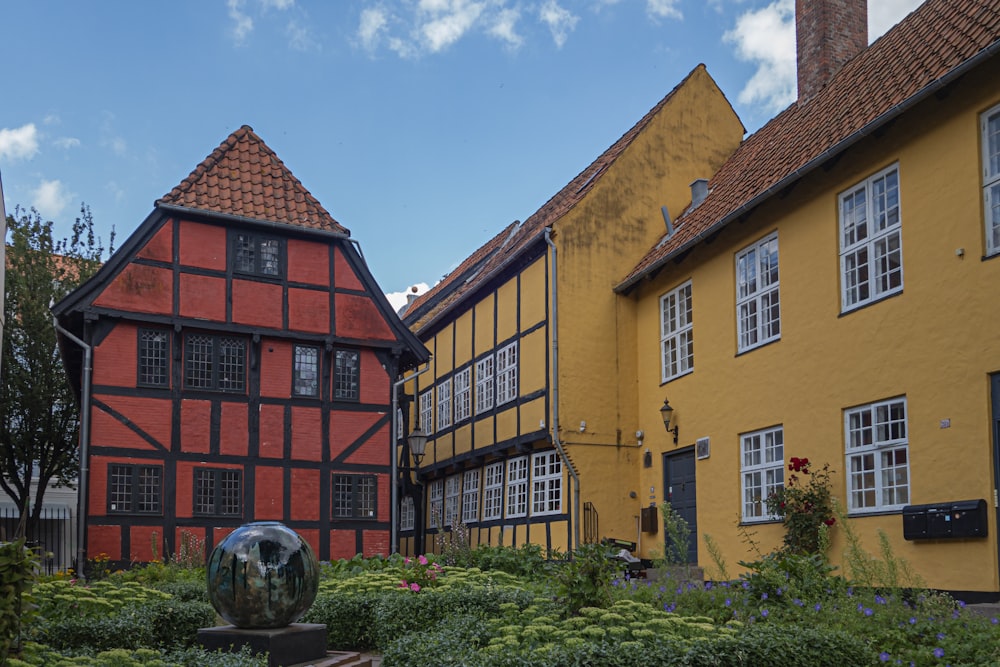 a row of buildings with a garden in front of them