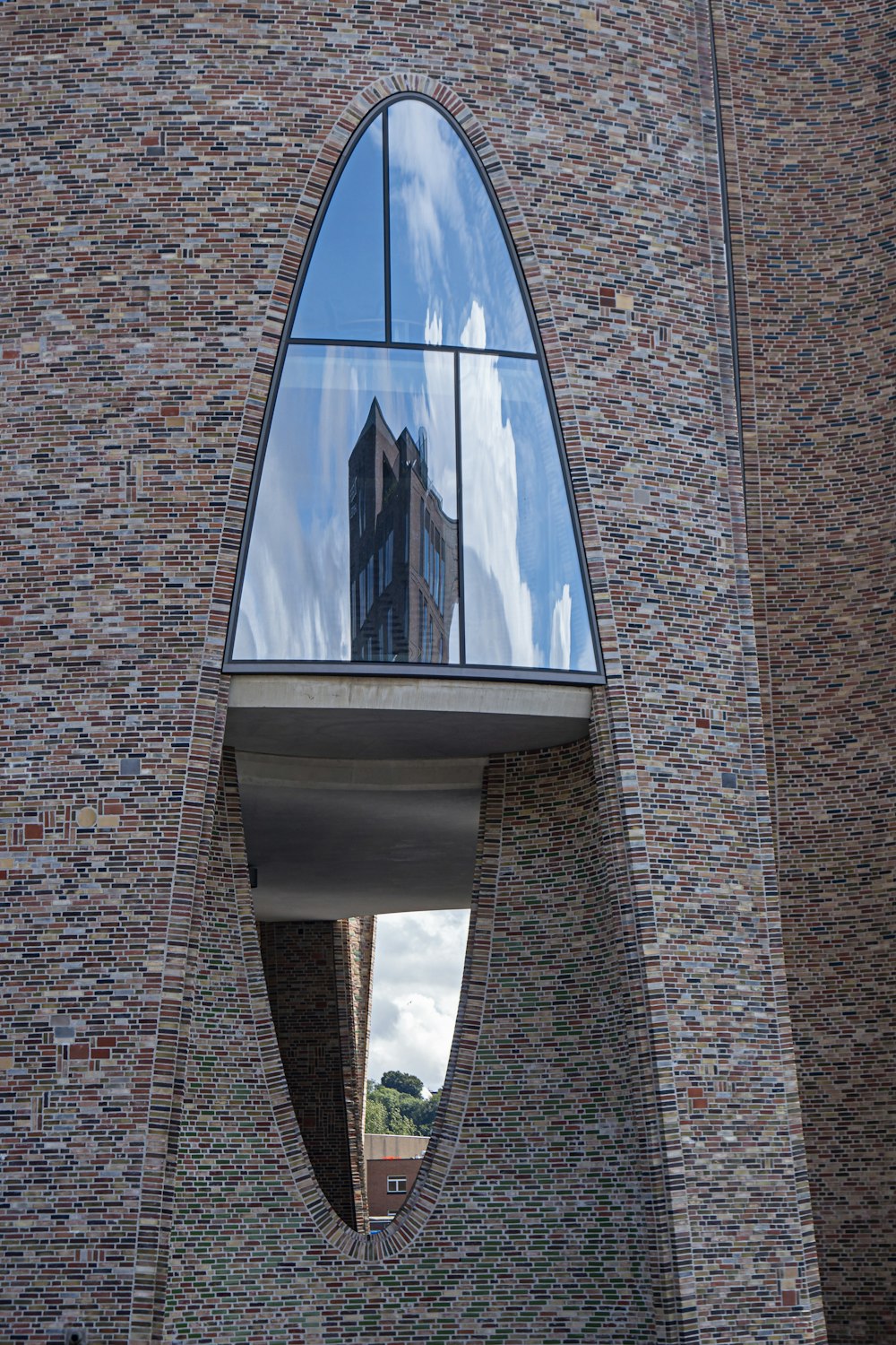 a reflection of a building in a mirror