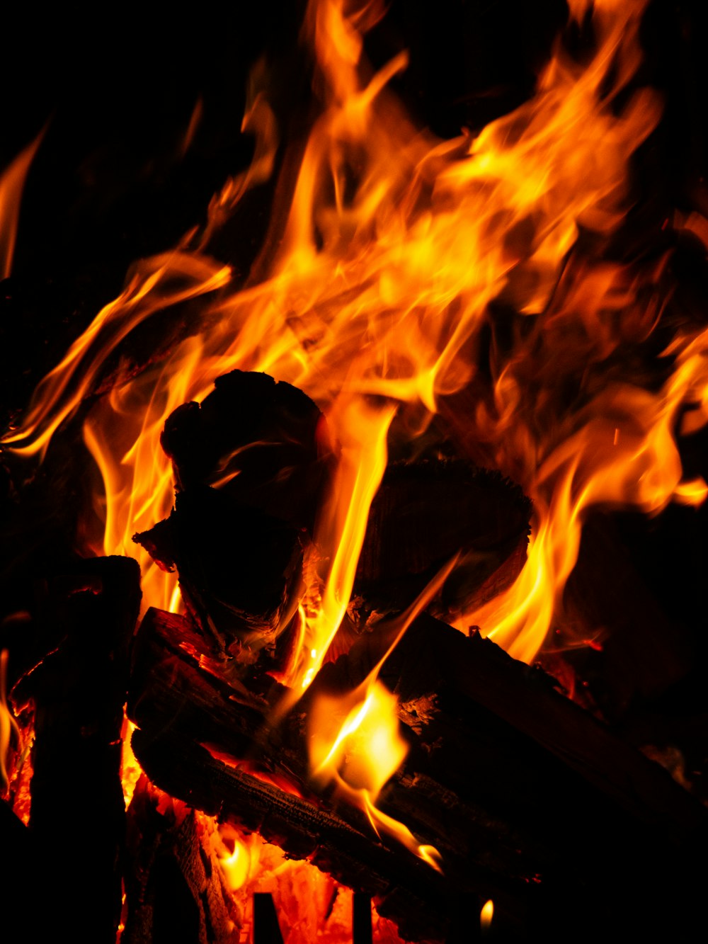 a close up of a fire in the dark