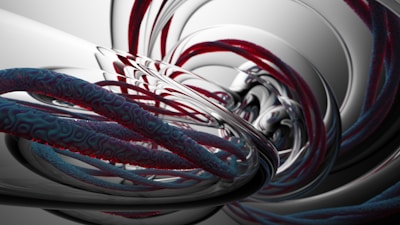 A digital abstract art piece featuring swirling, intertwined structures resembling twisted cables or ropes with a smooth, metallic appearance. The scene conveys a sense of motion and complexity through its intricate patterns and reflective surfaces, blending shades of red, blue, and silver.