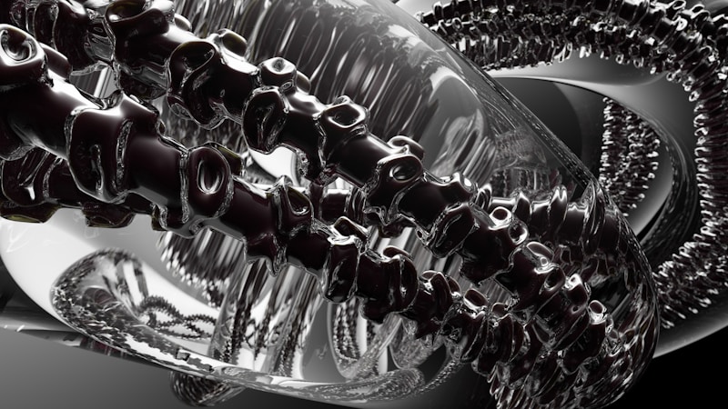 A complex, abstract digital image features intertwined metallic and glass-like structures, resembling a futuristic machine or art installation. Reflective surfaces create a dynamic interplay of light and shadow, with intricate details suggesting a sense of movement or transformation.