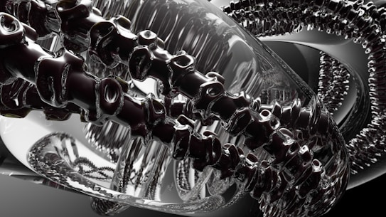 A complex, abstract digital image features intertwined metallic and glass-like structures, resembling a futuristic machine or art installation. Reflective surfaces create a dynamic interplay of light and shadow, with intricate details suggesting a sense of movement or transformation.