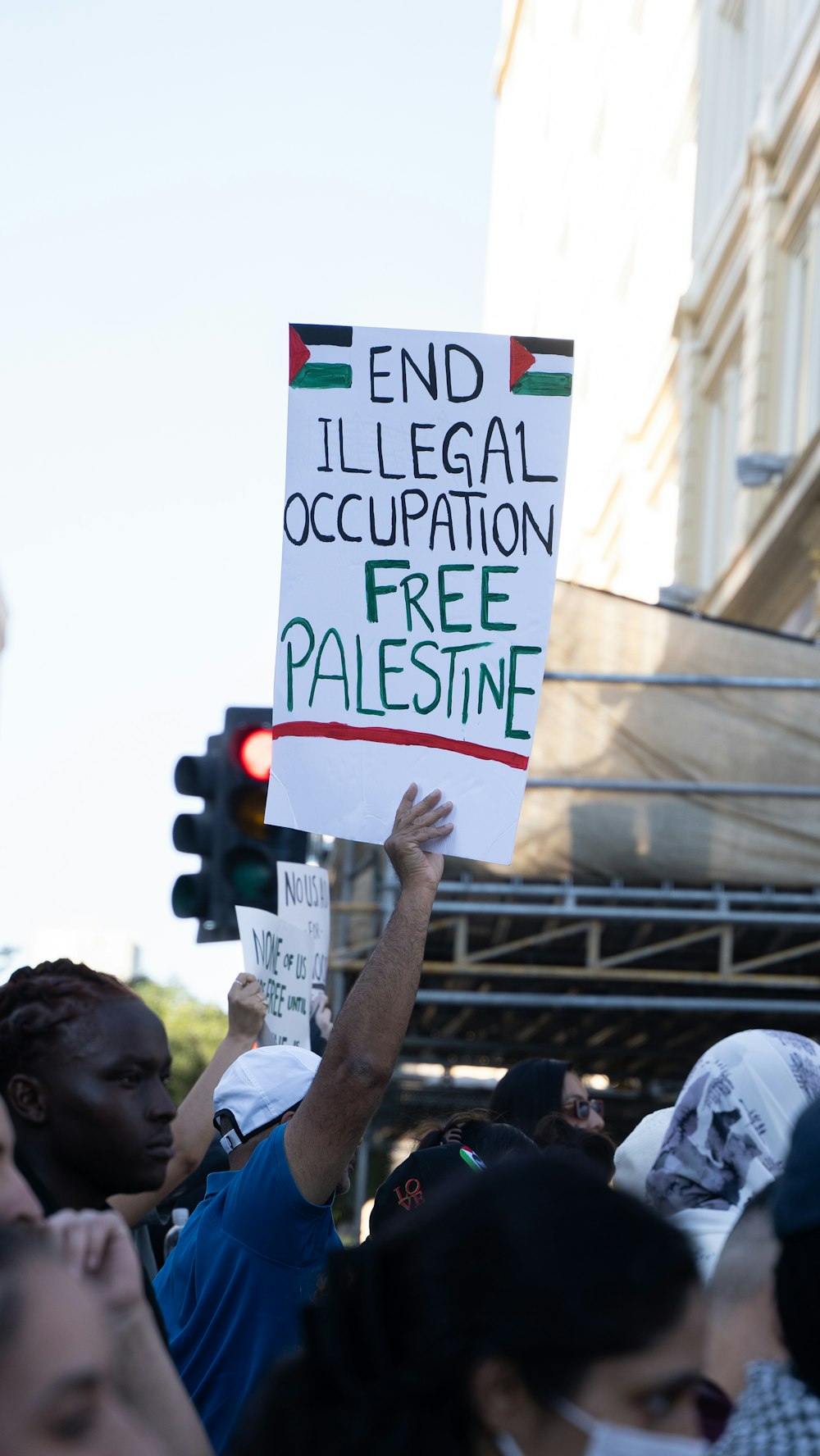 a group of people holding signs in the street