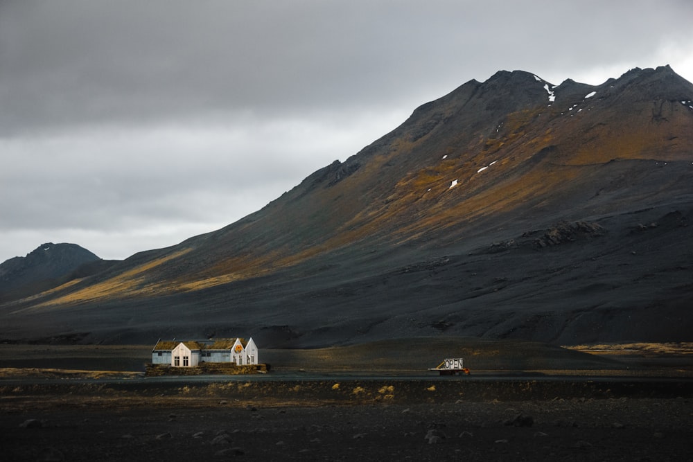 a house in the middle of a mountain range