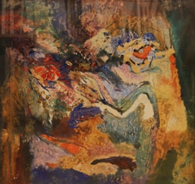 Abstract painting with vivid colors blending fluid shapes.