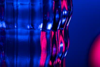 Close-up of a glowing glass panel highlighting its texture and light effects.
